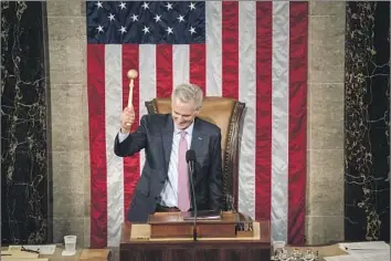  ?? Kent Nishimura Los Angeles Times ?? GOP LEADER Kevin McCarthy wields the speaker’s gavel for the first time after his victory early Saturday.