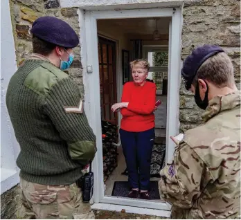  ?? ?? Aid: Troops offer help to residents in Weardale, County Durham, yesterday