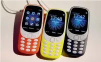  ?? — Reuters ?? Nokia has re-introduced brightly coloured versions of the classic 3310 talk and text phone.