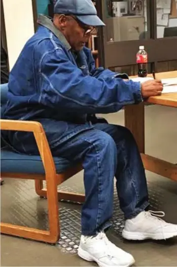  ??  ?? Free to go: OJ Simpson signs paperwork before leaving prison in the US yesterday