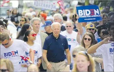  ?? Joshua Lott Getty Images ?? JOE BIDEN campaigns in Iowa. His political career spans decades of change in the nation’s attitudes on race.