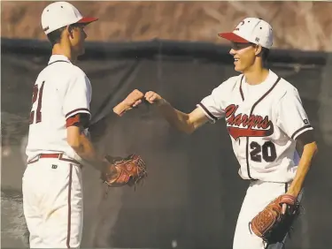  ?? Rogers family ?? The Giants’ Tyler Rogers (right) fistbumps twin brother Taylor after a game in their Colorado youth.