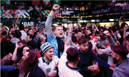  ?? Photograph: Henry Nicholls/Reuters ?? England fans celebratin­g victory against Wales at a venue in London last week.