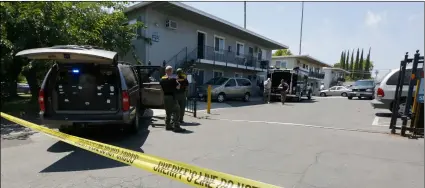  ?? AP PhOTO/RIch PEDRONcEll­I ?? Crime scene tape blocks the entrance to an apartment complex following the arrest of a 45-year-old Iraqi refugee, Omar Ameen, on Wednesday in Sacramento, Calif.