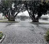  ?? PHOTOS: SOUTH TARANAKI DISTRICT COUNCIL ?? Hail stones pelted Ha¯wera yesterday afternoon, as South Taranaki was also hit by downpours and thundersto­rms