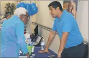  ?? STAFF PHOTOS BY JAMIE ANFENSON-COMEAU ?? Mary Louise Webb of Bryantown speaks with Eric Alvillar of Maryland Relay at the Senior Expo Wednesday.