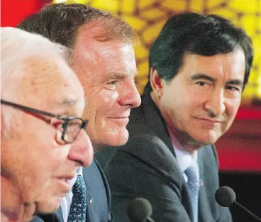  ?? GRAHAM HUGHES / THE CANADIAN PRESS ?? Group Jean Coutu chairman Jean Coutu, left, Metro Inc., president and CEO Eric La Flèche, centre, and Jean Coutu president and CEO François Coutu.