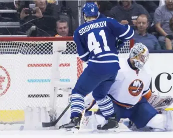  ?? NATHAN DENETTE/THE CANADIAN PRESS ?? Leafs winger Nikita Soshnikov undresses Isles goalie Thomas Greiss for the game-winner Wednesday night.