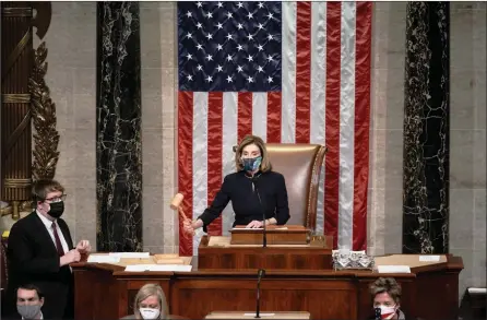  ?? The Associated Press ?? Speaker of the House Nancy Pelosi, D-Calif., leads the final vote Wednesday on the impeachmen­t of President Donald J. Trump for his role in inciting an angry mob to storm the Capitol in Washington a week ago.