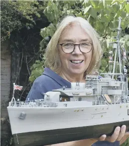  ??  ?? Julie Gibbs with her father’s model warship.