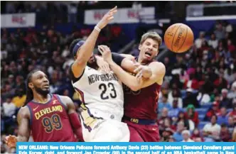  ??  ?? NEW ORLEANS: New Orleans Pelicans forward Anthony Davis (23) battles between Cleveland Cavaliers guard Kyle Korver, right, and forward Jae Crowder (99) in the second half of an NBA basketball game in New Orleans. — AP