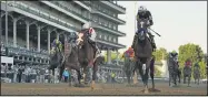  ?? JEFF ROBERSON — THE ASSOCIATED PRESS ?? Jockey John Velazquez riding Authentic, right, crosses the finish line to win the 146th running of the Kentucky Derby at Churchill Downs, on Sept. 5 in Louisville, Ky.