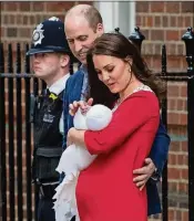  ?? CHRIS J. RATCLIFFE / GETTY IMAGES ?? Prince William and Catherine leave the Lindo Wing of St. Mary’s Hospital with their newborn baby boy on Monday in London.