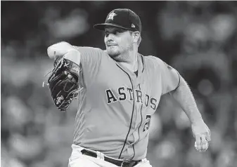  ?? Marie D. De Jesús / Staff photograph­er ?? Wade Miley had his strikeout pitch working Friday night at Minute Maid Park. The Astros lefthander fanned eight Boston batters over six innings.