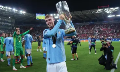  ?? ?? Manchester City’s Cole Palmer celebrates with the Uefa Super Cup. Photograph: Álex Caparrós/UEFA/Getty Images