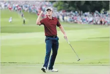  ?? TIM BRADBURY GETTY IMAGES ?? Justin Rose celebrates after making a putt for birdie on the 18th green to win the 2018 FedEx Cup in the final round of the Tour Championsh­ip.