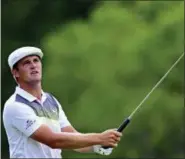  ?? DAVID DERMER — THE ASSOCIATED PRESS ?? Bryson DeChambeau follows his tee shot on the 18th hole during the third round of the Memorial golf tournament Saturday in Dublin, Ohio.