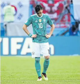  ??  ?? Germany’s Mesut Oezil looks dejected after the match against South Korea.