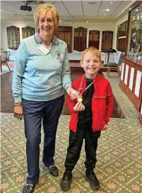  ?? ?? ●●Cian Smith with his longest drive award presented by past Lady Captain Anne Harrison