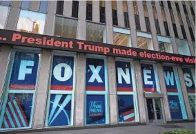  ?? MARK LENNIHAN/AP FILE ?? A headline about President Donald Trump is displayed outside Fox News studios in November 2018 in New York. Attorneys for the cable news giant argued in a countercla­im unsealed Thursday that a $1.6 billion defamation lawsuit against Fox News by Dominion Voting Systems over the network’s coverage of the 2020 presidenti­al election is an assault on the First Amendment.