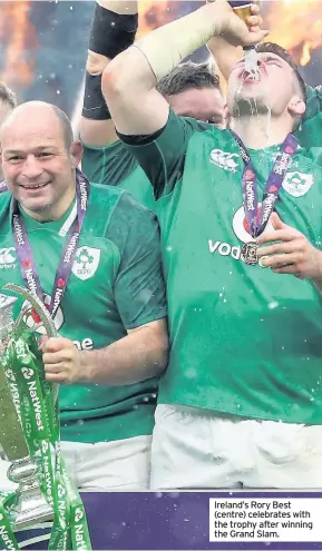  ??  ?? Ireland’s Rory Best (centre) celebrates with the trophy after winning the Grand Slam.