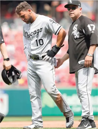  ??  ?? Sox manager Rick Renteria checks on Yoan Moncada, who left the game in the eighth inning with tightness in his left hamstring. AP