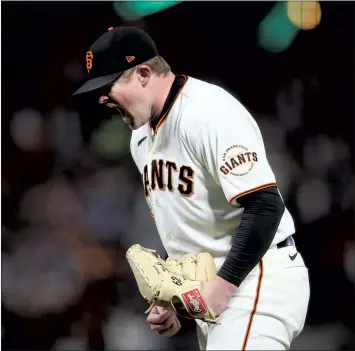  ?? ?? Giants starting pitcher Logan Webb reacts after striking out the Los Angeles Dodgers’ Cody Bellinger with two outs in the seventh inning of Game 1 of the National League Division Series at Oracle Park.