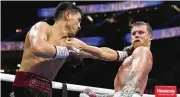  ?? JOHN LOCHER / ASSOCIATED PRESS ?? Dmitry Bivol (left) throws a punch against Canelo Alvarez during their light heavyweigh­t title fight Saturdayn Las Vegas.