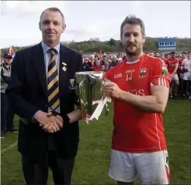  ??  ?? County chairman Martin Fitzgerald presents Alan Driver with the O’Donoghue Cup.