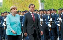  ?? PHOTO: REUTERS ?? German Chancellor Angela Merkel welcomes South Korean President Moon Jae In in Berlin yesterday ahead of the G20 summit.