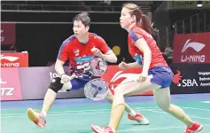  ??  ?? Goh Soon Huat (left) and Shevon Jemie Lai of Malaysia prepare to hit a return to Tontowi Ahmad and Lillyana Natsir of Indonesia during their mixed doubles final at the Singapore Open badminton tournament in Singapore. — AFP photo