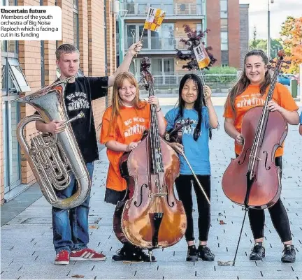  ??  ?? Uncertain future Members of the youth orchestra of Big Noise Raploch which is facing a cut in its funding