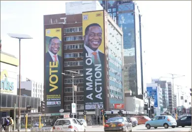  ??  ?? A campaign poster for President Mnangagwa on Throgmorto­n Building in Harare central business district as ZANU-PF released its manifesto for the 2018 harmonised elections later this year. — (Picture by Munyaradzi Chamalimba)