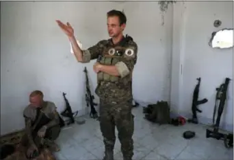  ?? HUSSEIN MALLA - THE ASSOCIATED PRESS ?? In this Monday photo, Taylor Hudson, a 33-year old from Pasadena, California, who fights with an Assyrian militia, that is part of the U.S-backed forces battling Islamic State group militants, gives an interview to The Associated Press, on the western...