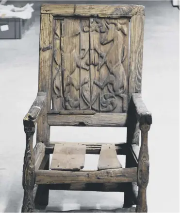  ??  ?? 0 The chair has the remains of a post-1603 lion and unicorn carving on the back panel