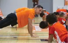  ?? CHRIS SO/TORONTO STAR FILE PHOTO ?? Steve Nash leads public school students through warmups at the YMCA on Grosvenor Street. in an event in February, the last time he was in Toronto.