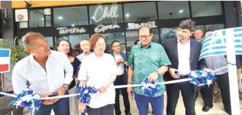  ?? ?? Liew (second left), Bangkuai (second right), Plainiotis (right) and Embiricos (left) cutting the ribbon to officially open Chill Taverna.