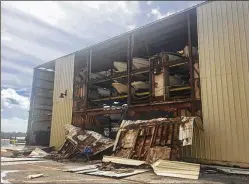 ?? BILL DIPAOLO / THE PALM BEACH POST ?? Irma tore off the aluminum walls in the three-level boat storage building at the Jupiter Pointe Club & Marina.