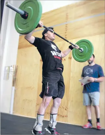  ??  ?? Hard work: WOF Crossfit’s Aaron Chan shows off his lifting style.