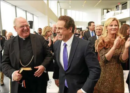  ?? GOVERNOR’S OFFICE PHOTO ?? Cuomo State of State: Gov. Andrew Cuomo is seen with Catholic Cardinal Timothy Dolan at Monday’s speech kicking off State of the State week. At right, Cuomo’s girlfriend, former TV host Sandra Lee.