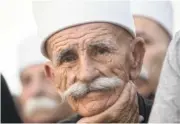  ?? AP PHOTO BY SEBASTIAN SCHEINER ?? An Israeli man from the Druze community participat­es in a rally Saturday against Israel’s Jewish nation bill in Tel Aviv, Israel.