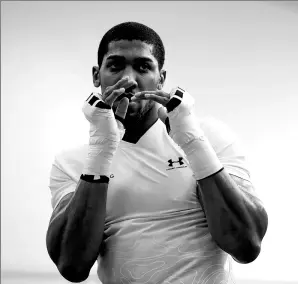  ?? ACTION IMAGES VIA REUTERS ?? Anthony Joshua strikes a pose at the English Institute for Sport in Sheffield last Wednesday.