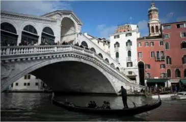 ?? AFP/VNA Photo ?? STORMY WATERS: Considered one of the most beautiful cities on the planet, Venice is one of the world's top tourist destinatio­ns.
