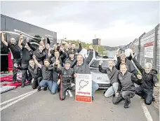  ?? PHOTOS FROM MERCEDES-BENZ WEBSITE ?? The Mercedes-AMG team celebrate after their AMG ONE set a new record at the Nürburgrin­g-Nordschlei­fe for road-legal production cars on Oct. 28, 2022.