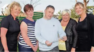  ??  ?? Cancer fundraiser­s LtoR Shan Williams from the A5 Barbers in Valley, Breast Cancer survivor Enid Williams of Llangaffo, Medwyn Huws and sister Marina Lloyd with Jade Goddard of the Beauty Lounge