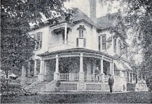  ?? 1906 WATERLOO COUNTY PROGRESS BOOKLET ?? Dr. Charles T. Noecker and wife Roxy raised two children, Eloise and Claude, in this attractive home at 54 Albert St. It was also his medical office. Claude sits on the porch railing in a 1906 photograph while the doctor stands nearby. Minus its wraparound porch, the house remains in place in 2021, two doors north of the old Carnegie Library building.