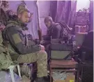  ?? ANATOLII STEPANOV/AFP VIA GETTY IMAGES ?? Ukrainian servicemen sit in a hideout Monday in the Donetsk region of Ukraine. Donetsk Governor Pavlo Kyrylenko said that power and communicat­ions were nonexisten­t in most of the region.