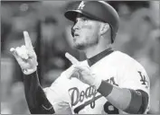 ?? Allen J. Schaben Los Angeles Times ?? YASMANI GRANDAL has until next week to decide about the Dodgers’ qualifying offer of $17.9 million.