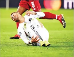  ?? FRANK FIFE/AFP ?? Paris Saint-Germain forward Neymar reacts after a tackle during the Champions League match against Liverpool at the Parc des Princes stadium on Wednesday.