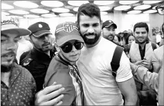  ??  ?? Diego Costa poses with an Atletico Madrid’s supporter upon arriving at Adolfo Suarez Madrid Barajas airport in Madrid, Spain. — Reuters photo